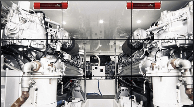 Auto ampoules mounted above marine engines in an engine room