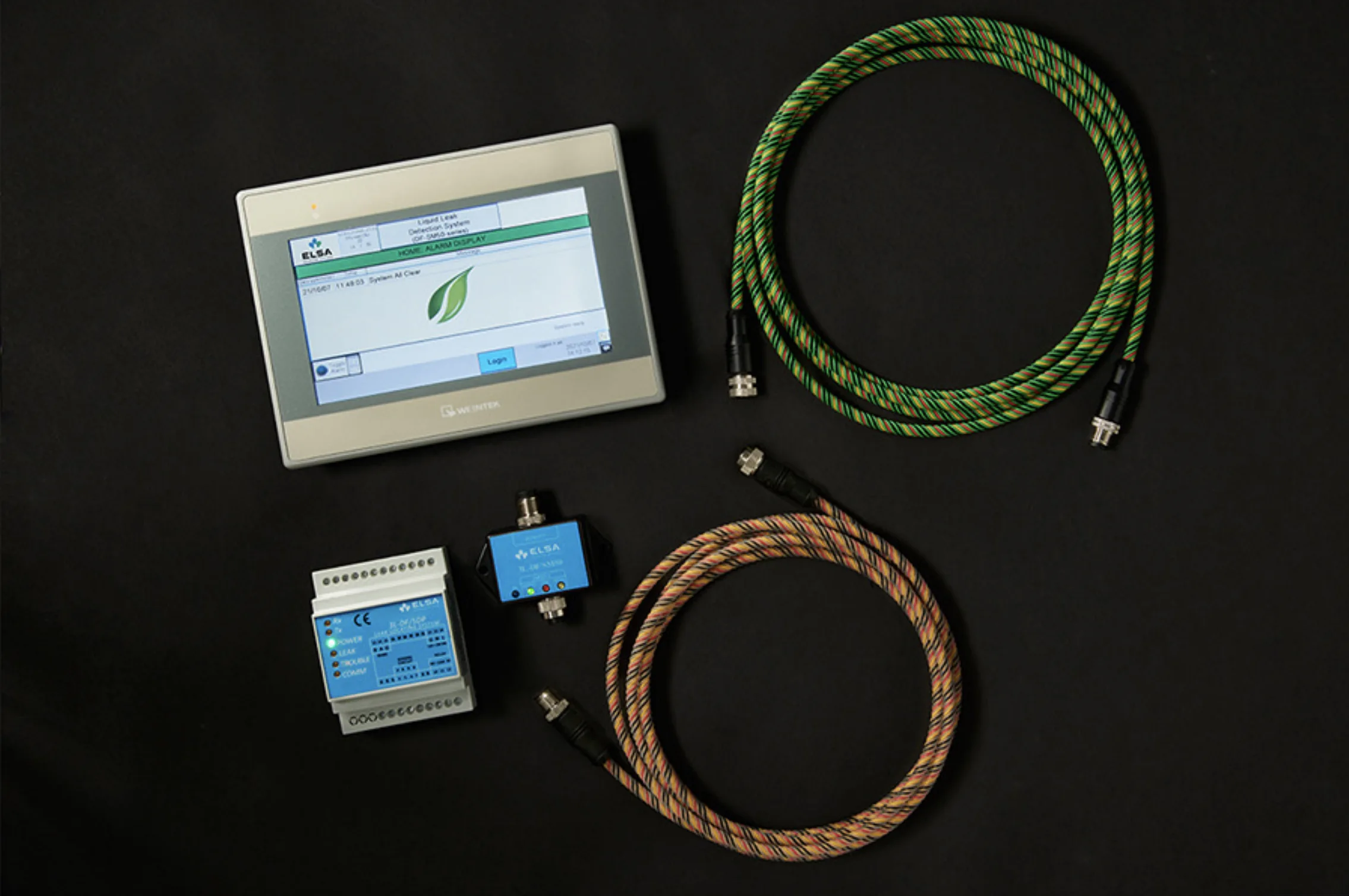 ELSA Standard Series liquid leak detection system: touchscreen HMI, leak-locating module, interface module and water and acid sensing cables