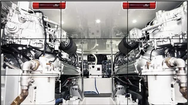 Auto ampoules mounted above marine engines in an engine room
